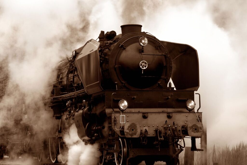 close up shot of old Steam Locomotive in smoke.