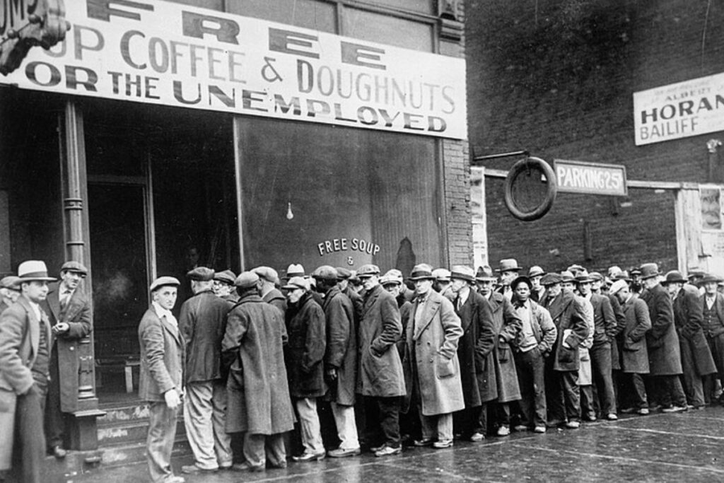 Unemployed men queued outside a depression soup kitchen opened in Chicago by Al Capone